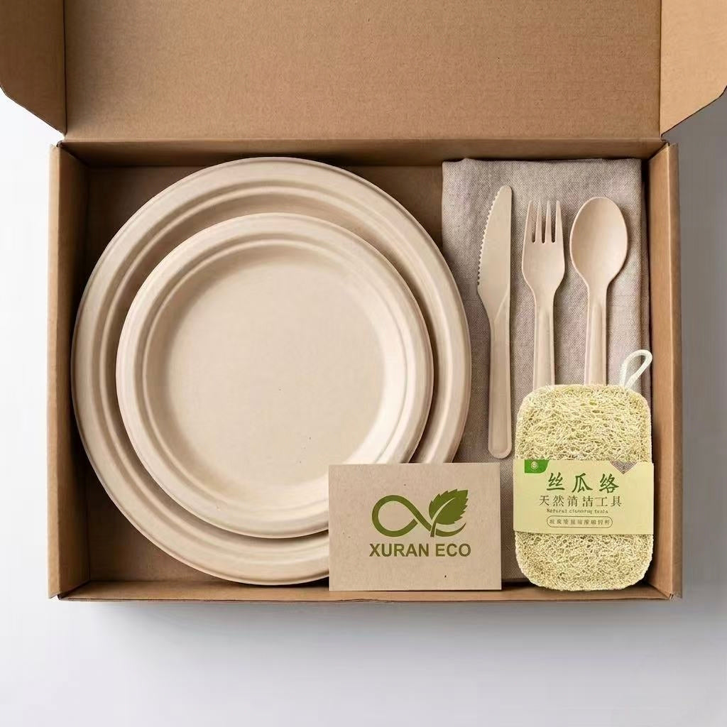 Zero-waste starter kit gift box containing sugarcane plates, plant-fiber cutlery, and natural loofah, with a 'Thank You' card and Xuran Eco logo.