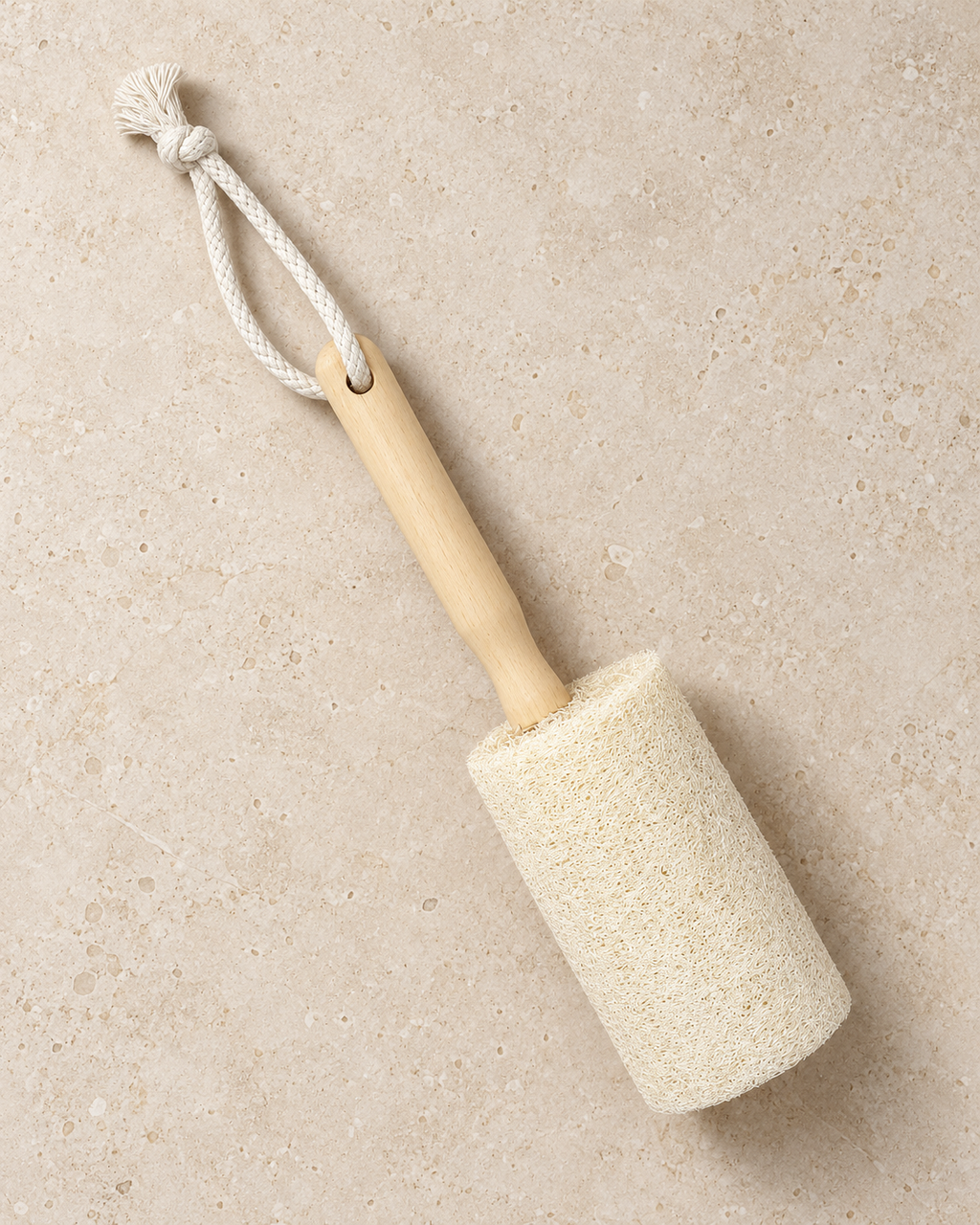 Top view of a natural loofah cup brush showing its wooden handle and hanging loop