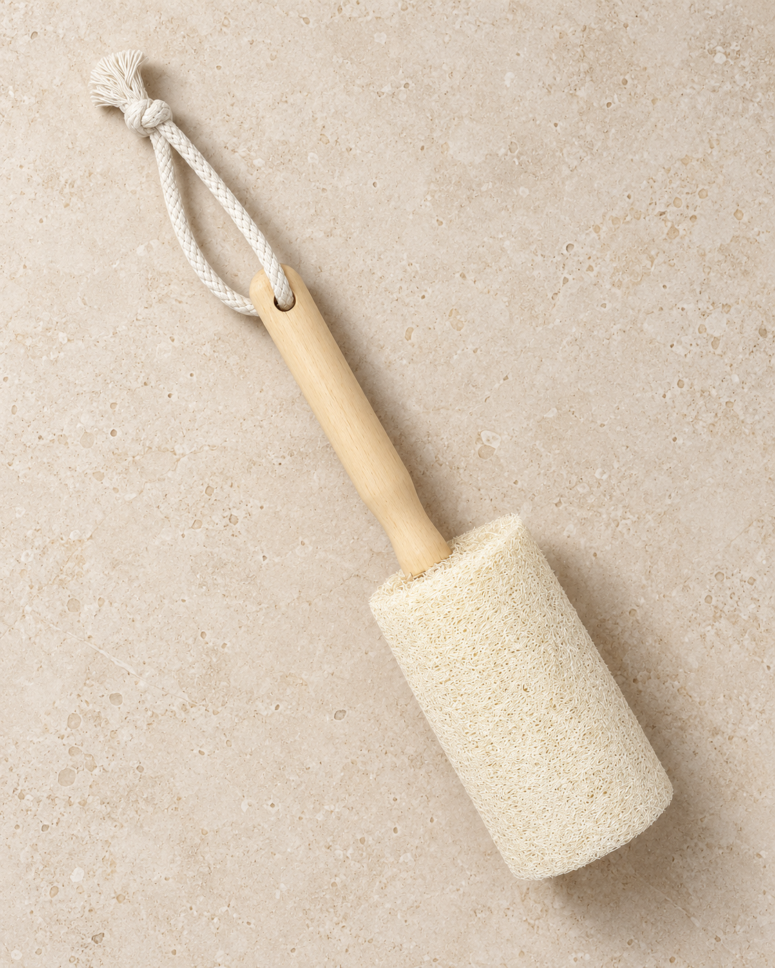 Top view of a natural loofah cup brush showing its wooden handle and hanging loop