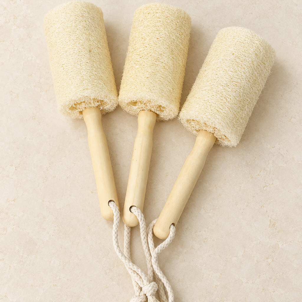Three natural loofah cup brushes showing slight variations in fiber texture