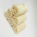 Natural loofah segment scrubber cross section detail, porous plant fiber kitchen cleaning sponge with hanging rope