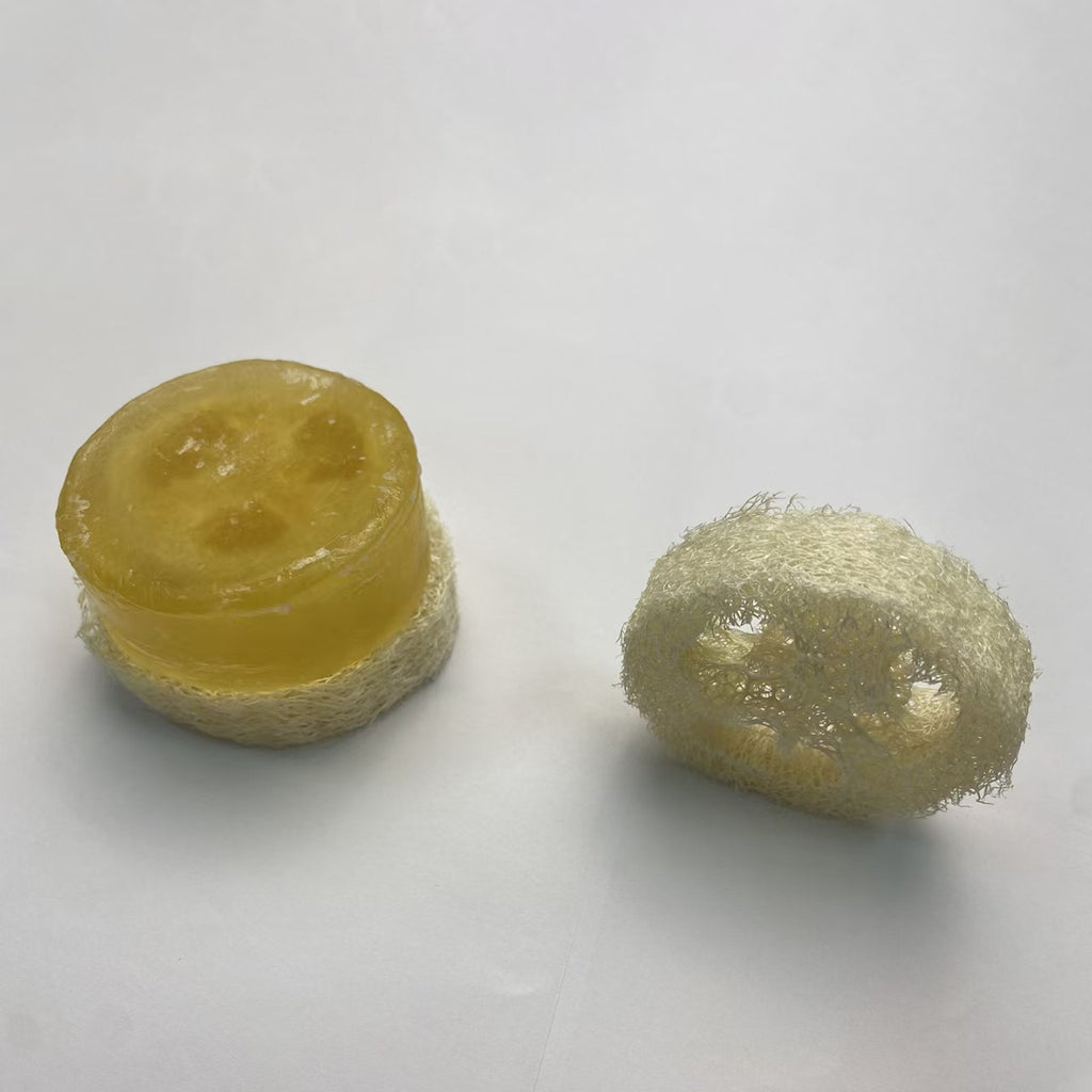 Natural loofah pad holding handmade soap, quick drain soap saver for shower