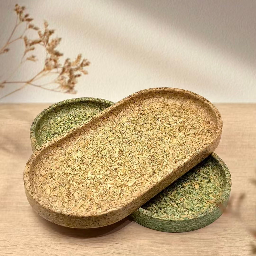 Three moisture-proof and flame-retardant bio-composite valet trays stacked, highlighting raw materials textures.