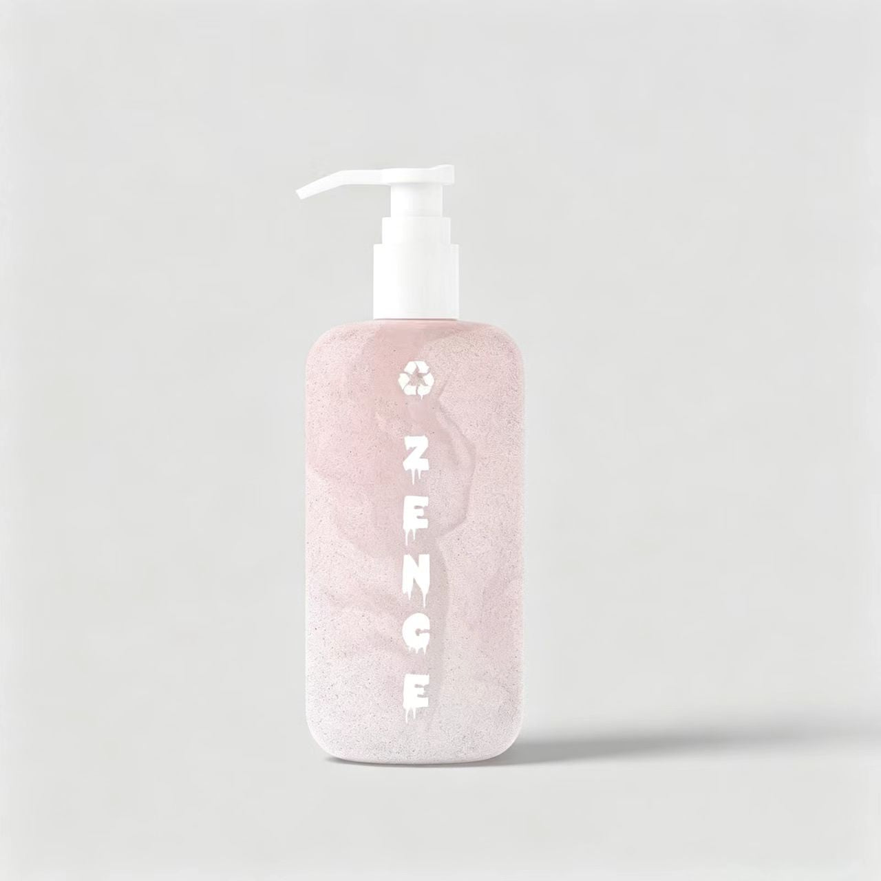 Matte pink bio-based cosmetic lotion pump bottle with a sustainability logo, showcased on a minimalist light gray background.