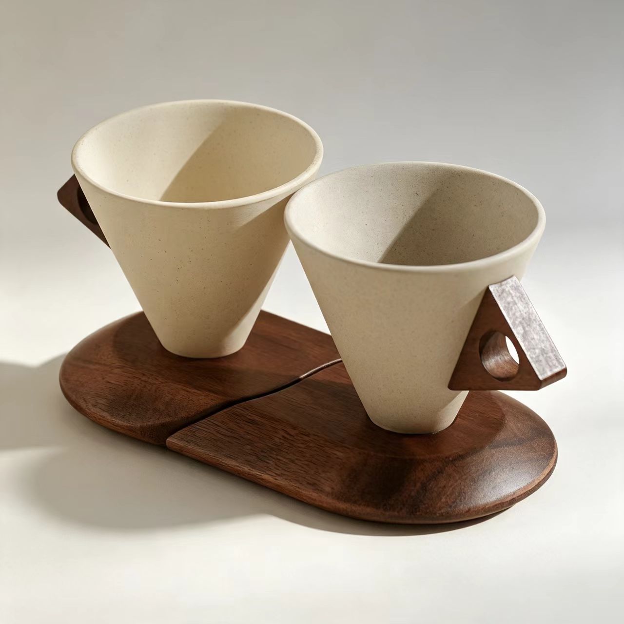 Top view minimalist cone stoneware coffee mug set with wooden handle and split wooden coaster on plain white background