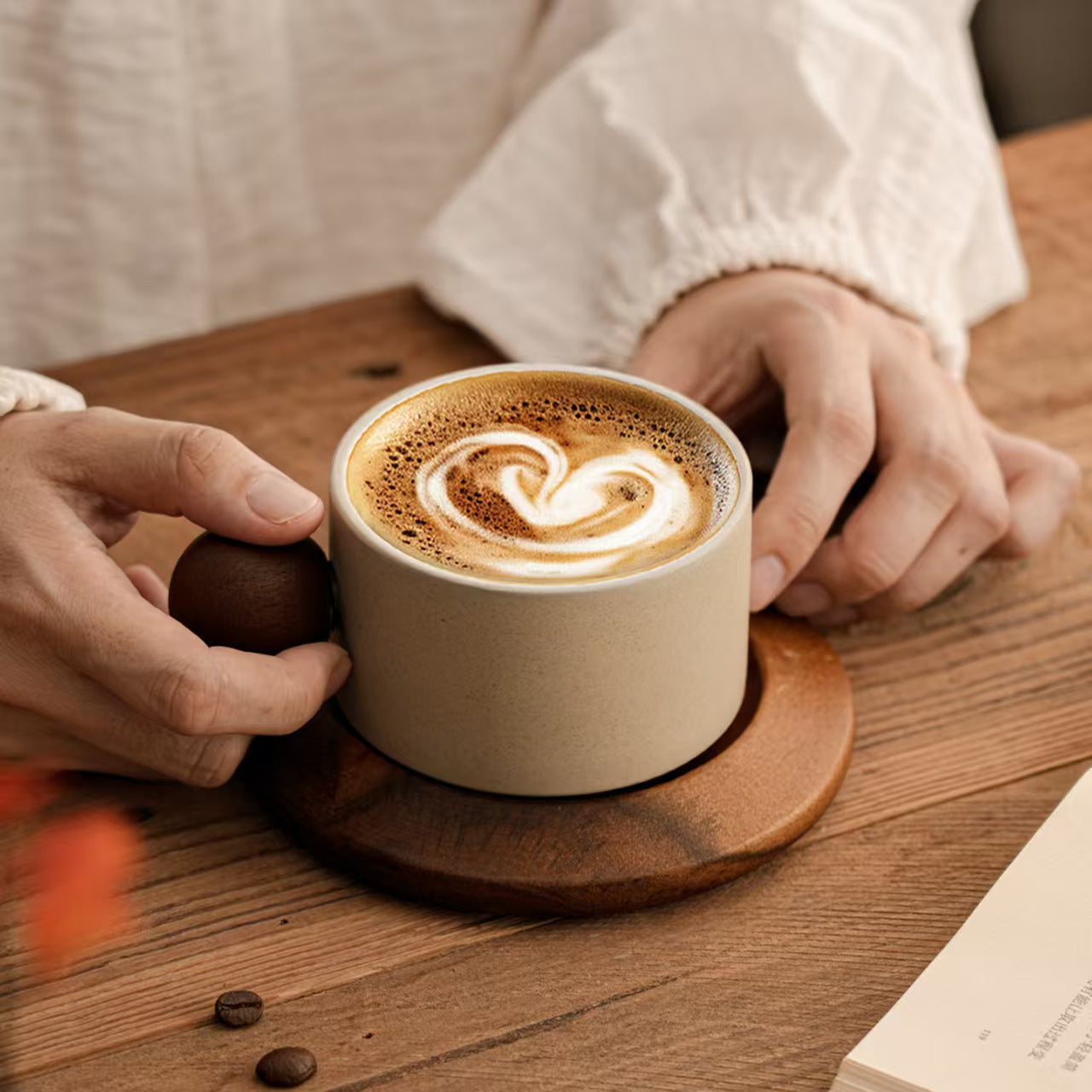 Stoneware coffee mug with walnut sphere knob handle, ergonomic grip, matte textured ceramic cup
