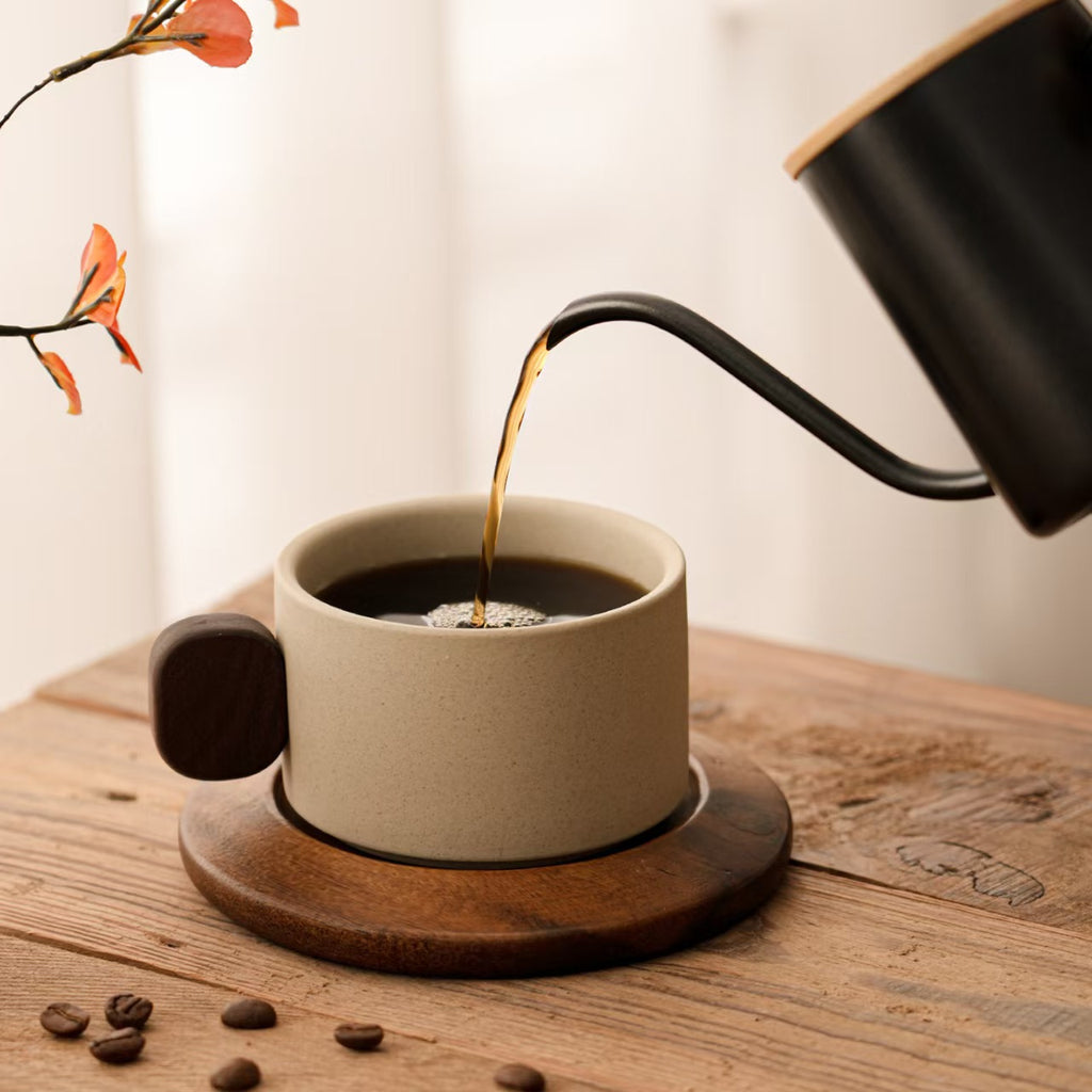 Terracotta stoneware coffee mug with solid wood handle, minimalist pour over coffee setup, rustic handmade wabi sabi tableware