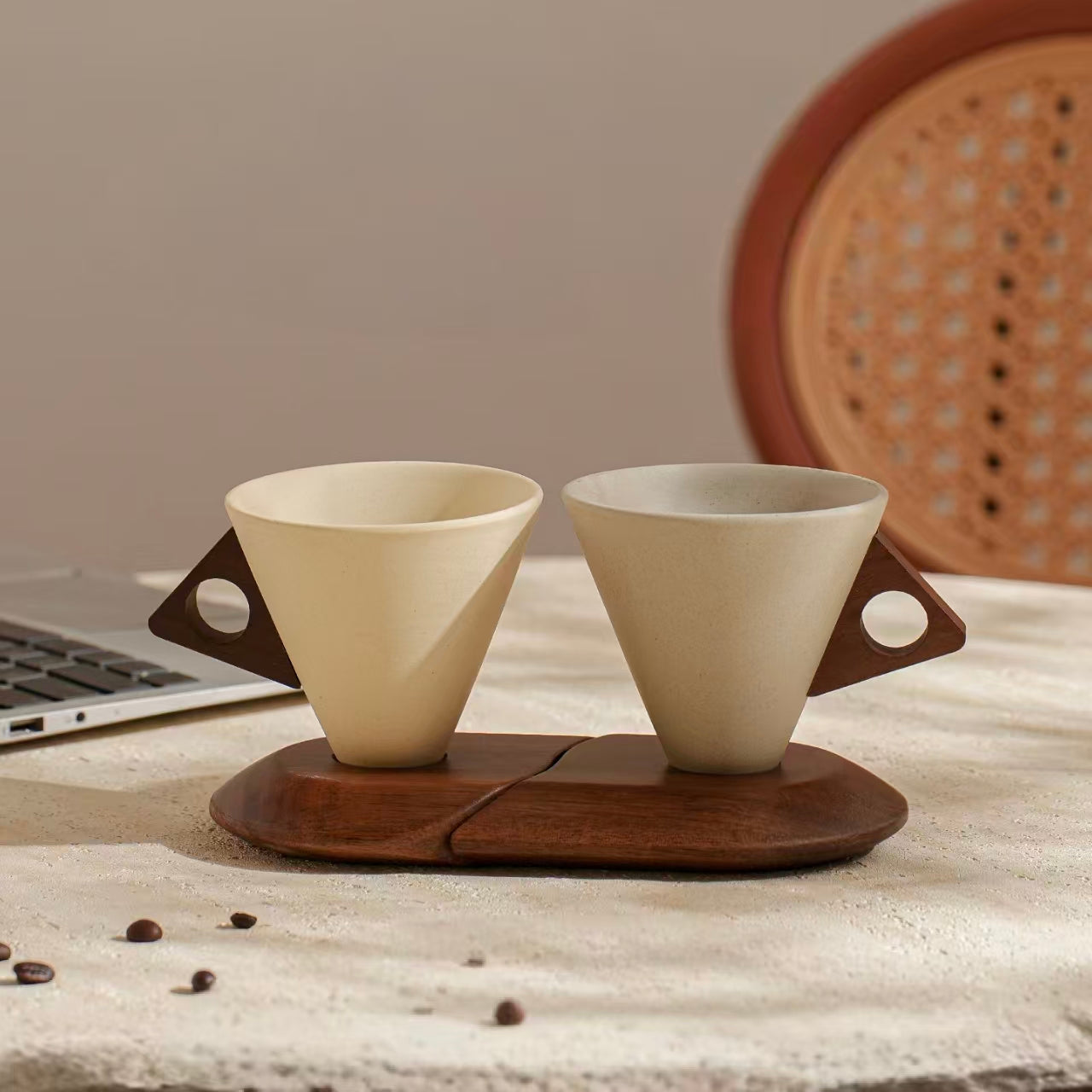 Two cone stoneware coffee cups with wooden handles and split stand, styled with coffee beans for home cafe decor