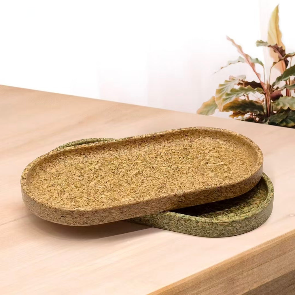 Stacked sustainable serving trays showcasing the organic tea-dregs texture and natural organic aesthetics.