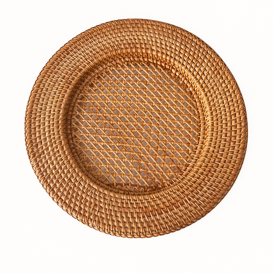 Handwoven round rattan charger plate with openwork weave center on white background by xuraneco