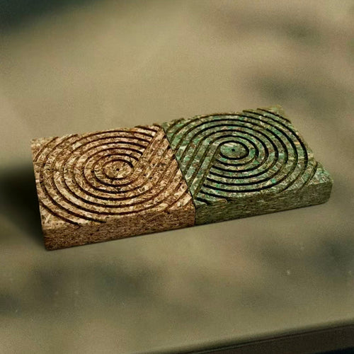 Two 3-in-1 eco-friendly tea fiber pressed panel coasters in natural brown and green by xuraneco