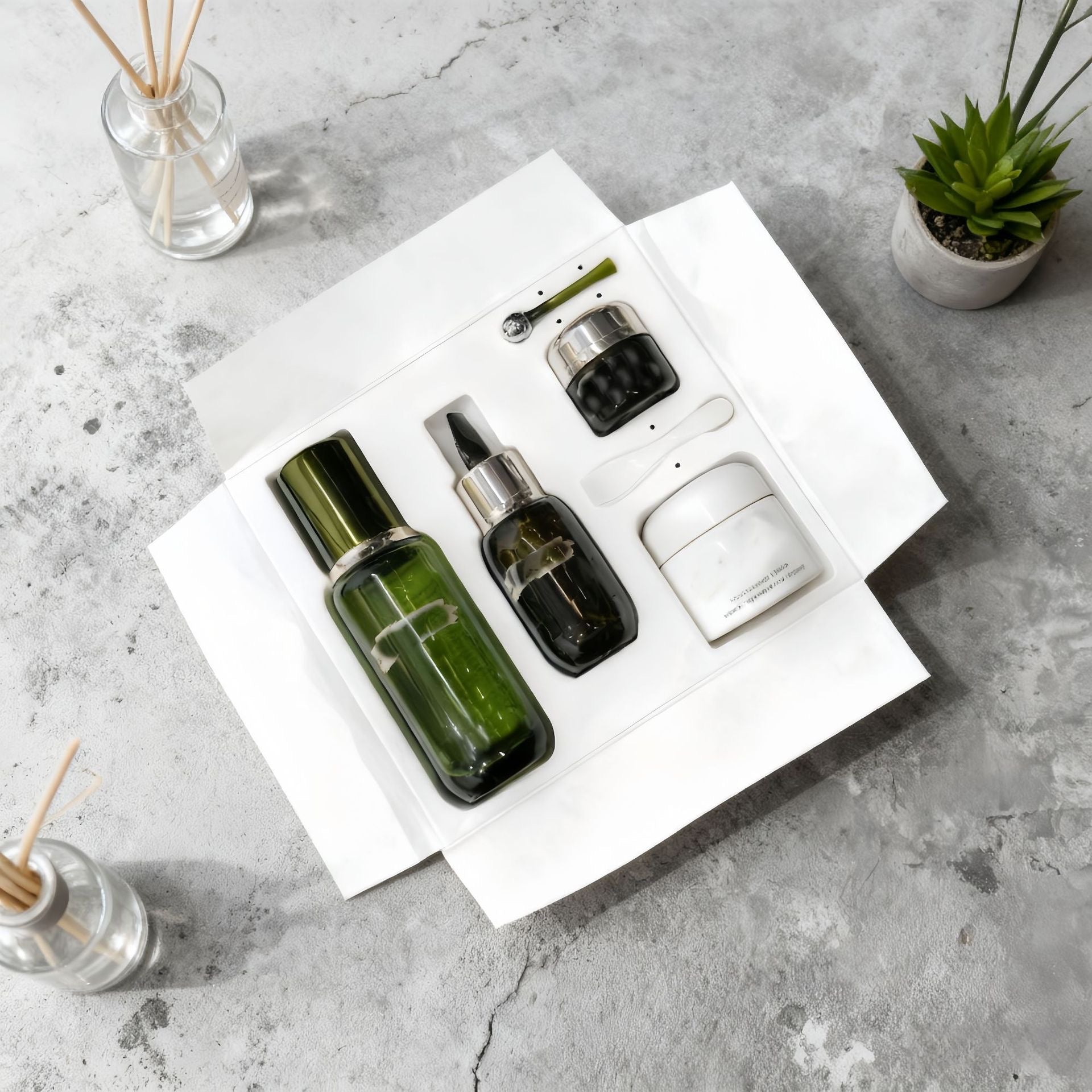 Skincare bottles and jars in a fitted gift-box insert