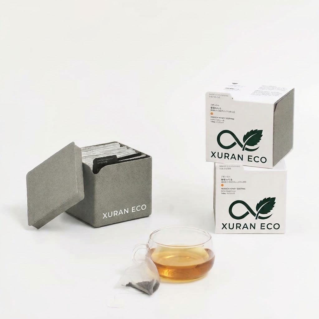 Concept visualization of a tea-fiber composite container with XURAN ECO branding